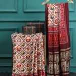 PATOLA IKKAT MAROON & OFFWHITE PRINT SAREE WITH HATHI BANARASI PALLU